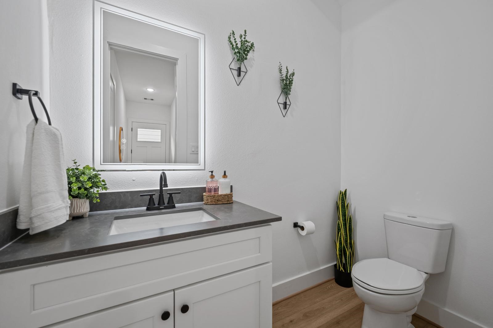 4201 Stassen Street Houston, TX 77051 - Photo 20 of 32 a bathroom with a granite countertop toilet sink and mirror