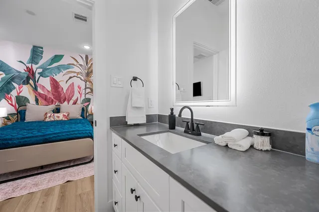 a bathroom with a sink and a mirror