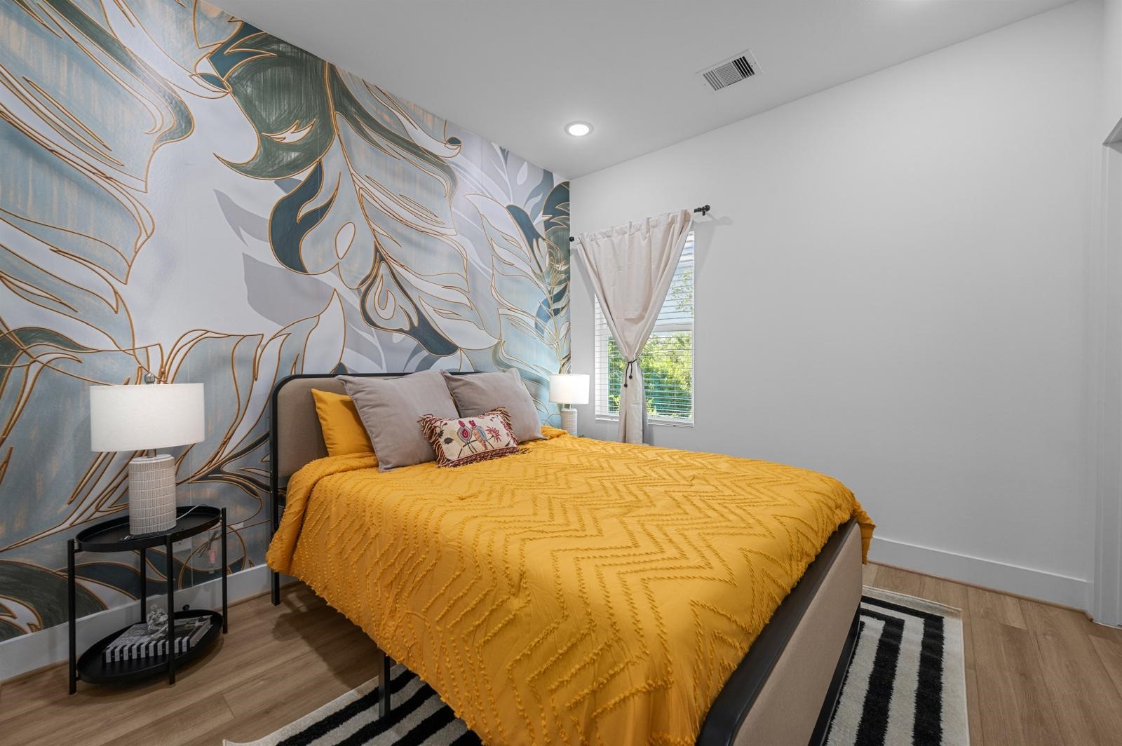 4201 Stassen Street Houston, TX 77051 - Photo 26 of 32 a bed sitting in a bedroom next to a window