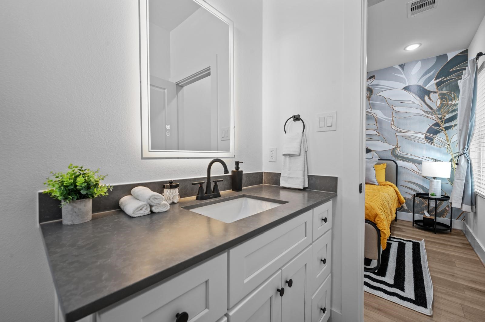 4201 Stassen Street Houston, TX 77051 - Photo 29 of 32 a bathroom with a sink and a mirror