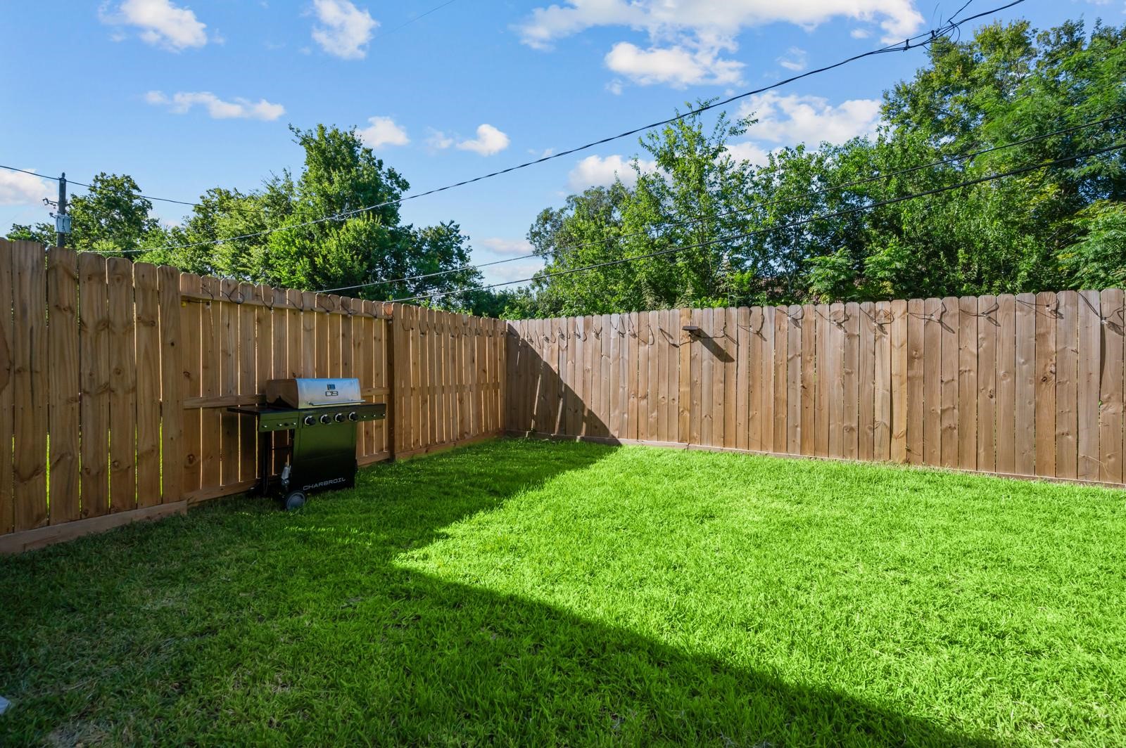 4201 Stassen Street Houston, TX 77051 - Photo 30 of 32 a view of a backyard with wooden fence