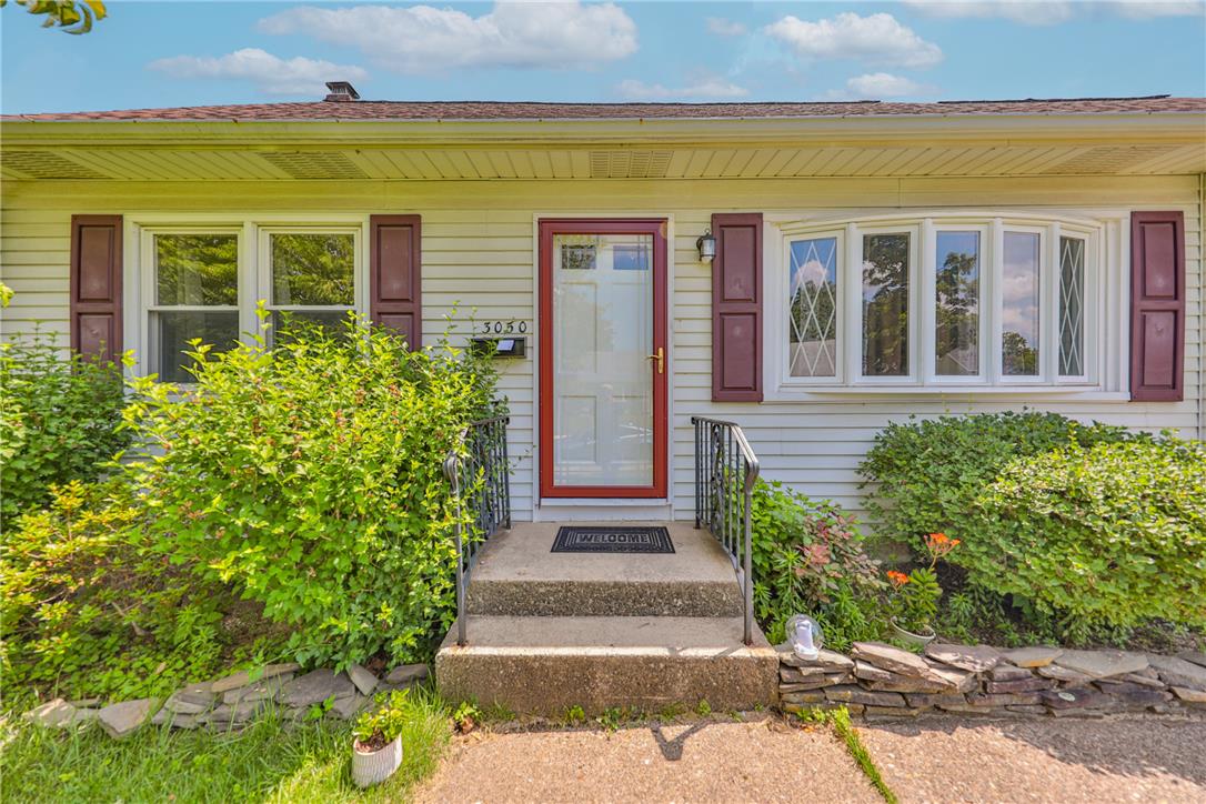 3050 Cornwall Road Bethlehem, PA 18017 - Photo 3 of 80 A classic facade welcomes with a charming front door and bay window, flanked by well-kept shrubbery.