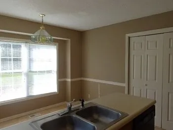 a bathroom with a sink and a window