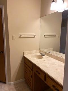825 Nun Court Abilene, TX 79602 - Photo 20 of 24 a bathroom with a granite countertop sink and a mirror
