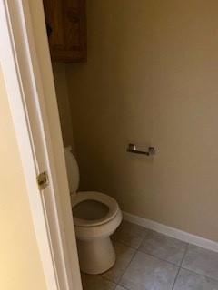 825 Nun Court Abilene, TX 79602 - Photo 22 of 24 a white toilet and sink in a bathroom