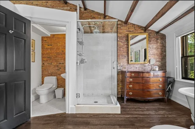 a living room with furniture a window and a chandelier