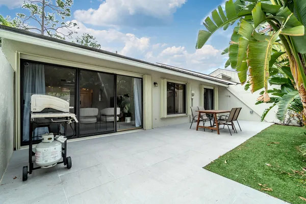a view of a house with a patio and a patio