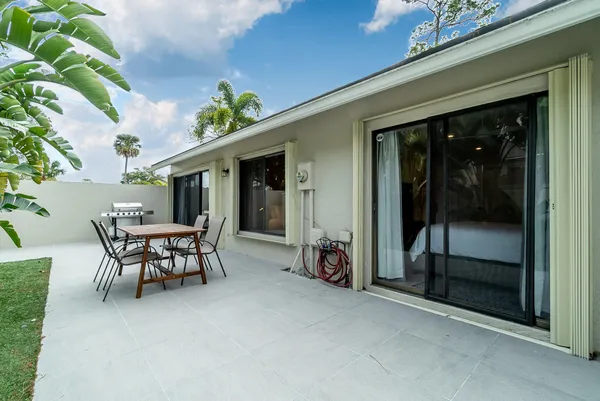 a view of a chairs and table in a room
