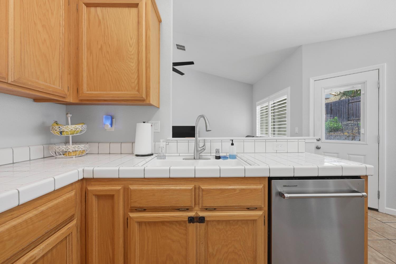 5013 Charter Road Rocklin, CA 95765 - Photo 13 of 35 a kitchen with stainless steel appliances granite countertop a sink and cabinets