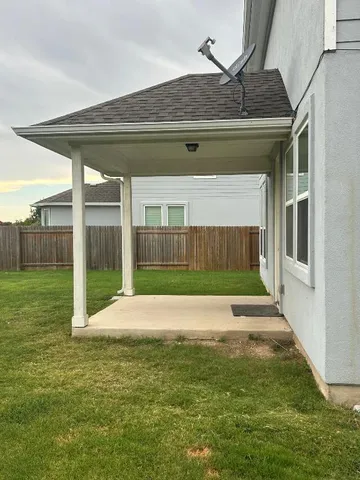 a view of a back yard of the house