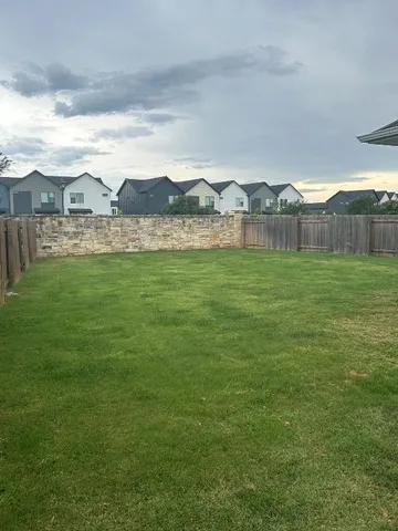 a view of a lake with a big yard