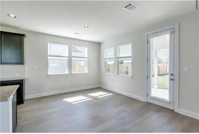 an empty room with windows