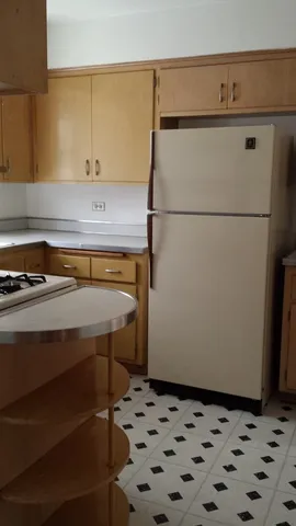 a stove top oven sitting inside of a kitchen