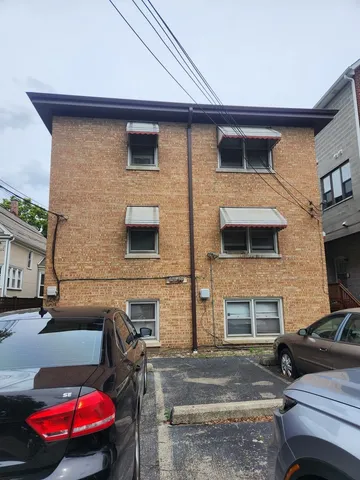 a view of a barbeque with seating space