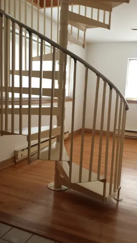 a view of staircase with lots of white walls
