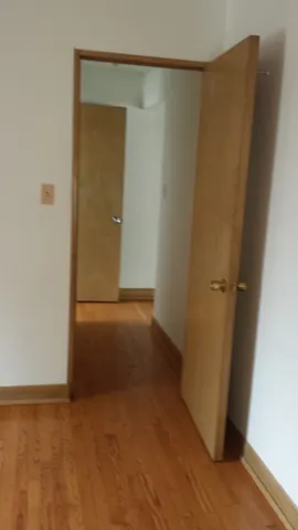 a bathroom with a window a toilet and a bathtub