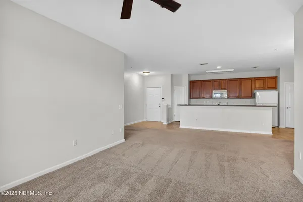a kitchen with stainless steel appliances granite countertop a refrigerator sink and cabinets