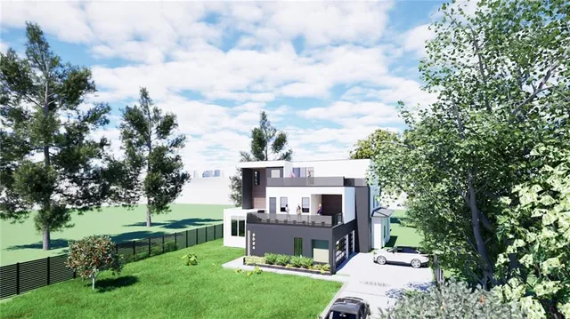 a front view of a house with a yard table and chairs