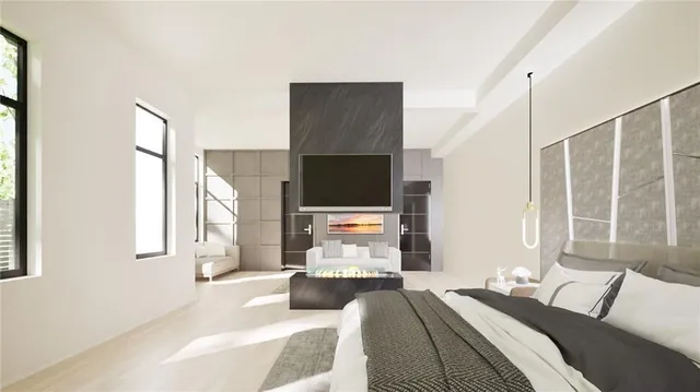 a living room with chairs and a fireplace