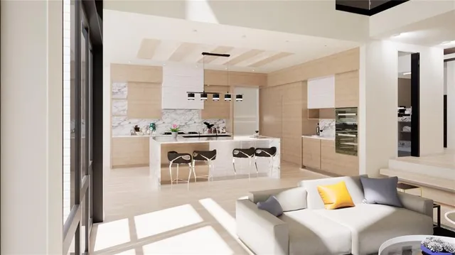 a living room with furniture kitchen view and a large window