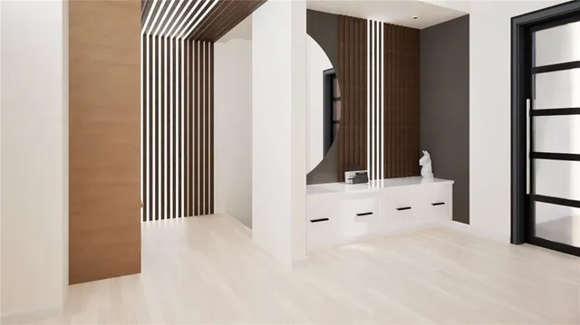 a kitchen with kitchen island a stove a sink a dining table and chairs