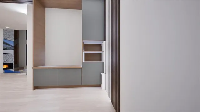 a view of a wooden house with lawn chairs and a yard