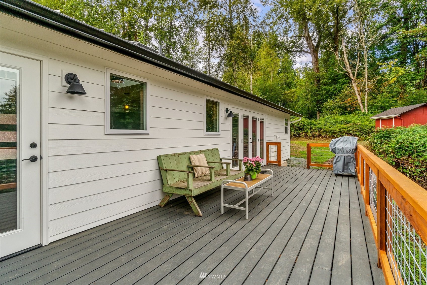 10302 Elliott Road Snohomish, WA 98296 - Photo 15 of 24 a view of a wooden chairs on deck