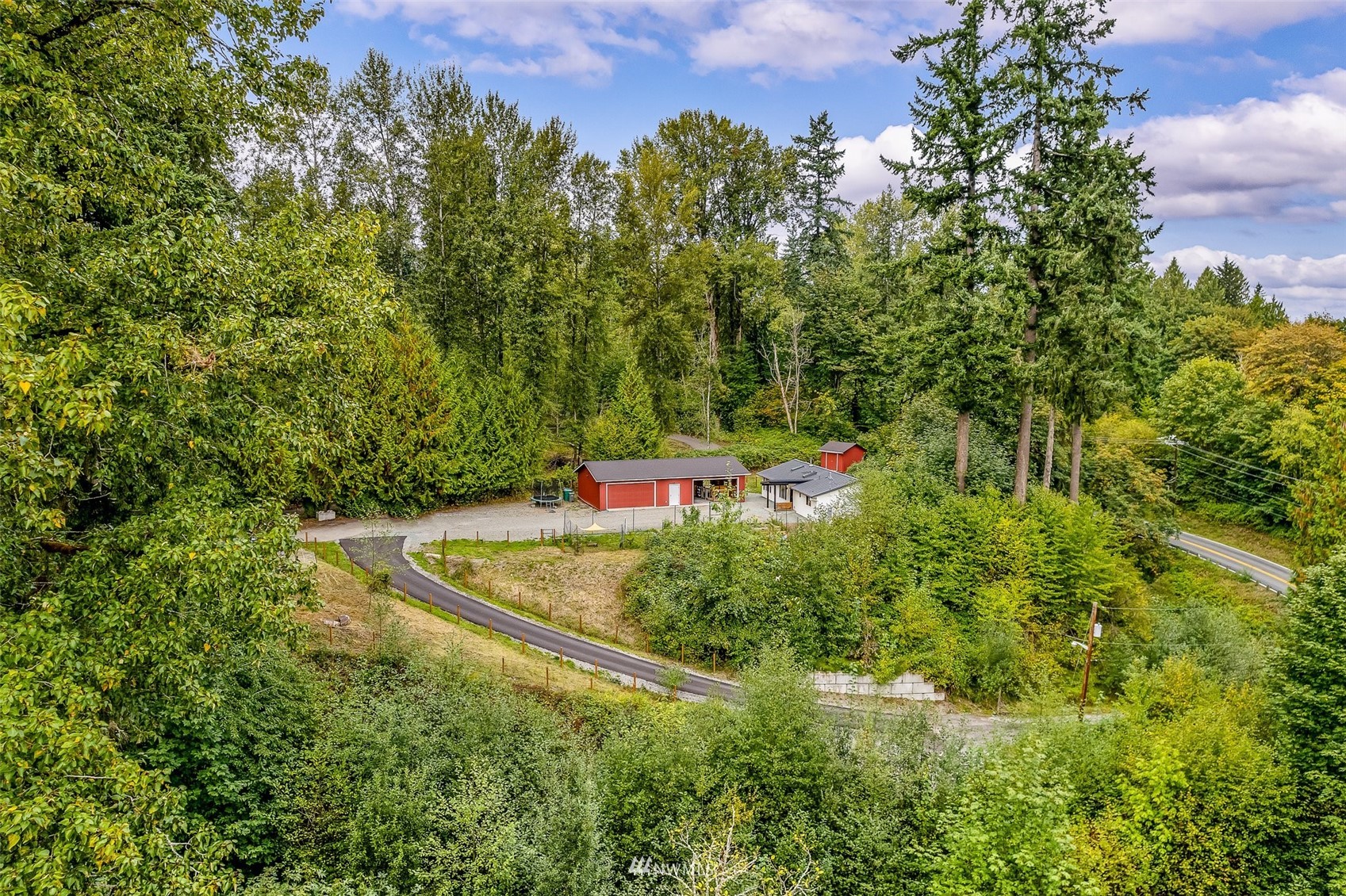 10302 Elliott Road Snohomish, WA 98296 - Photo 20 of 24 an aerial view of a house with a yard and outdoor seating