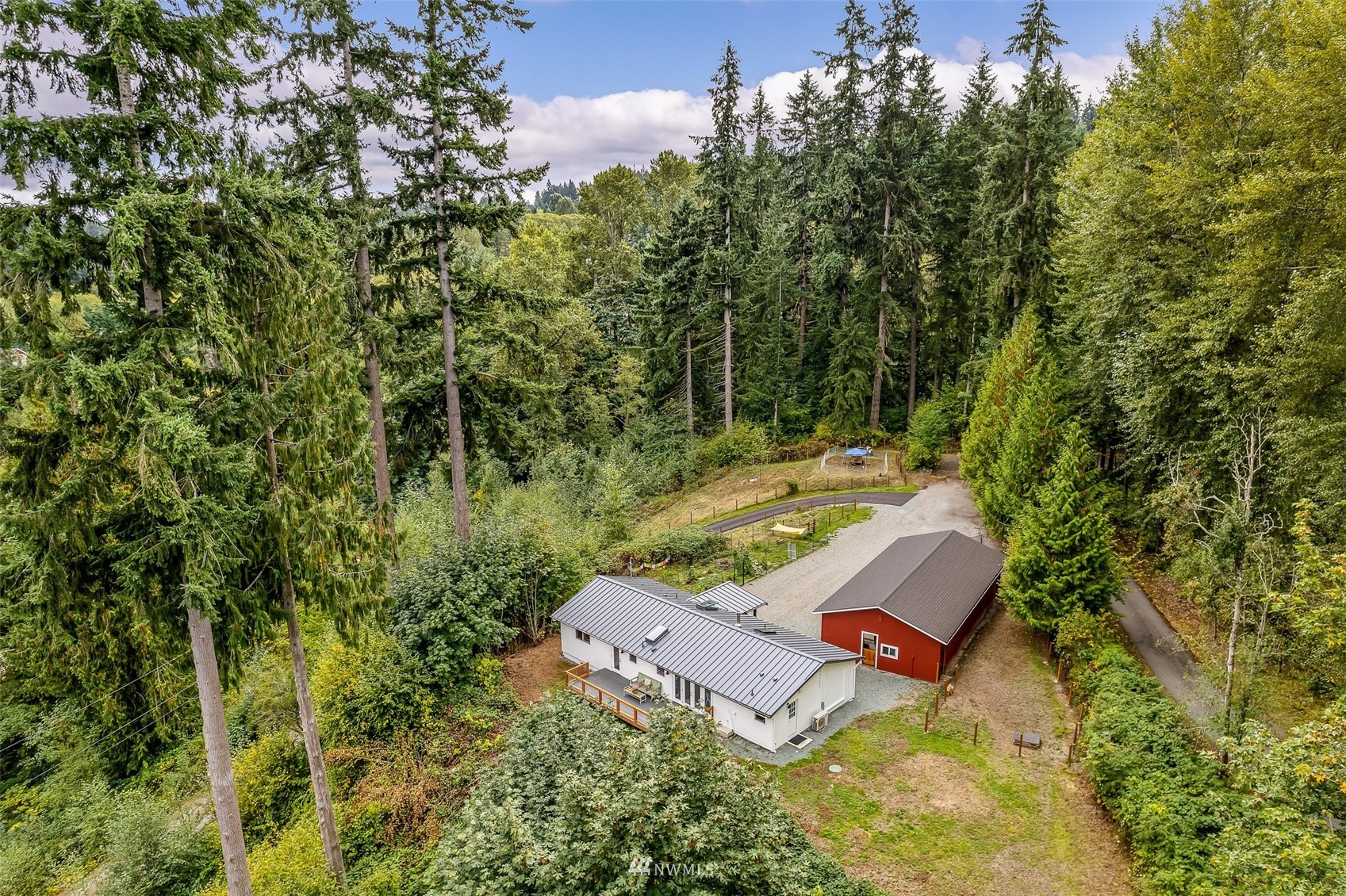 10302 Elliott Road Snohomish, WA 98296 - Photo 2 of 24 an aerial view of a house with swimming pool and outdoor space