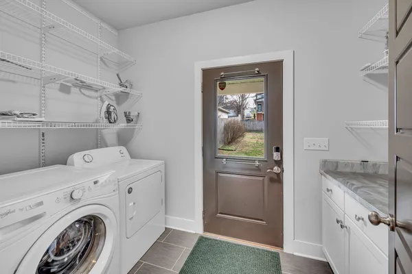 a view of a storage & utility room with washer and dryer