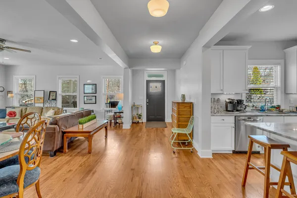 a room with lots of chairs and wooden floors