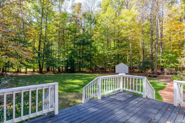 a view of deck and garden