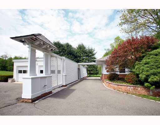 Undisclosed Address Darien, CT 06820 - Photo 16 of 16 a backyard of a house with wooden floor and fence