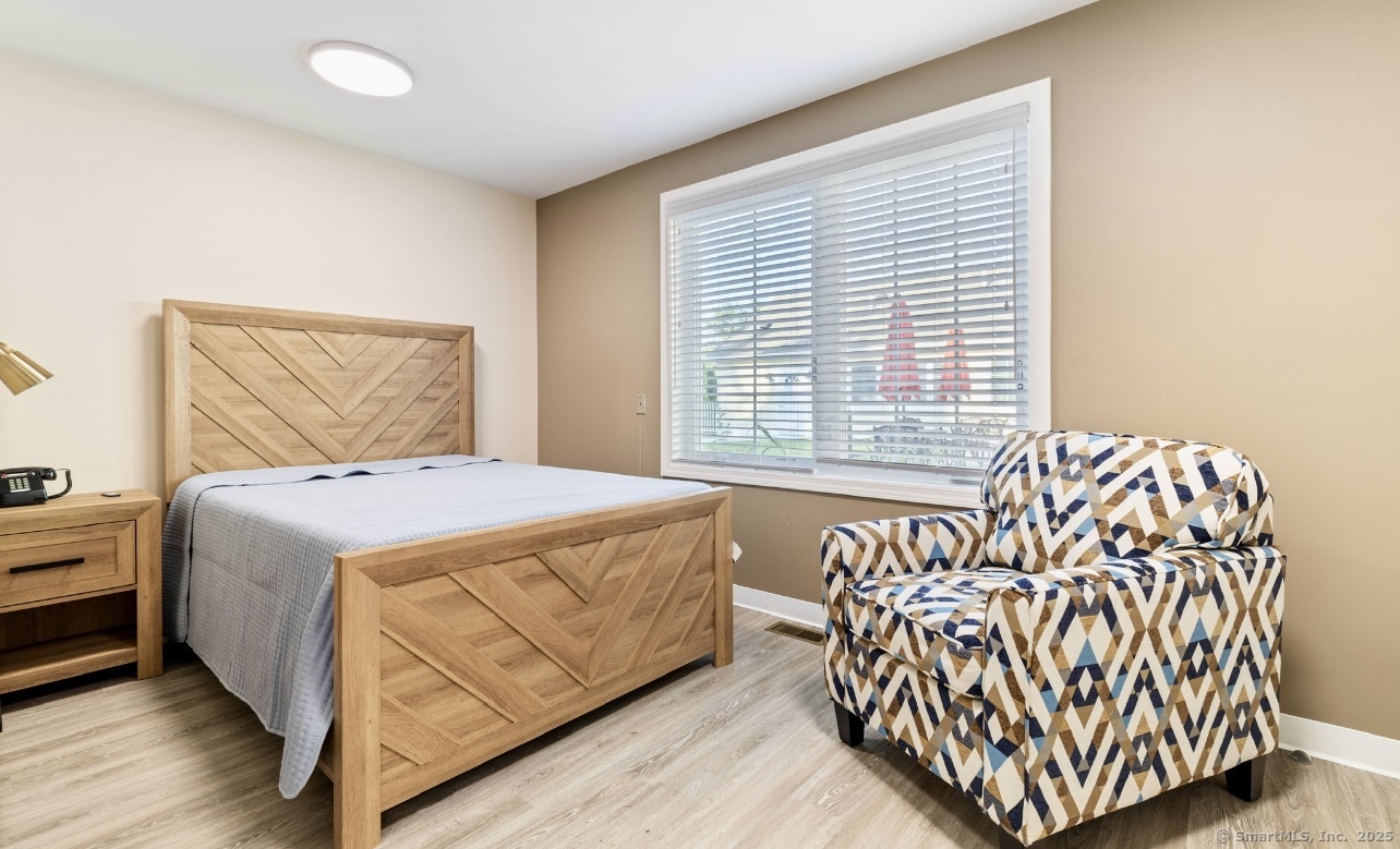 14 Godfrey Street Groton, CT 06355 - Photo 5 of 20 a bedroom with a bed and a couch