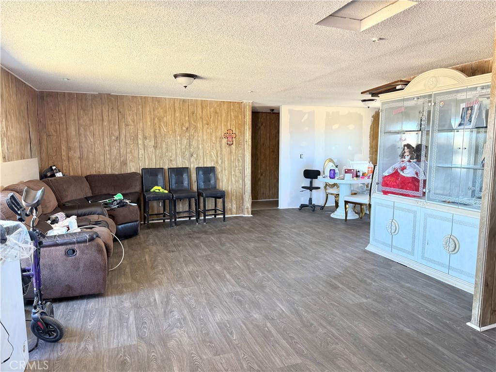 9589 Paramount Road Phelan, CA 92371 - Photo 10 of 29 a living room with furniture window and wooden floor