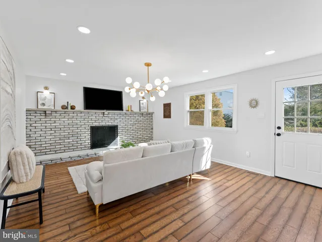 a bathroom with a sink mirror vanity and toilet