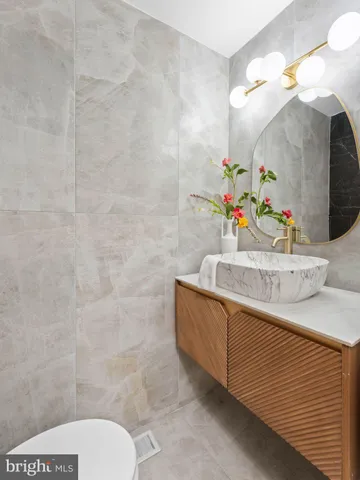 a very nice looking room with a large window and chandelier