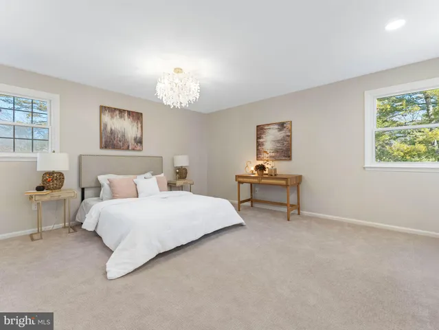 a bathroom with a sink mirror and vanity
