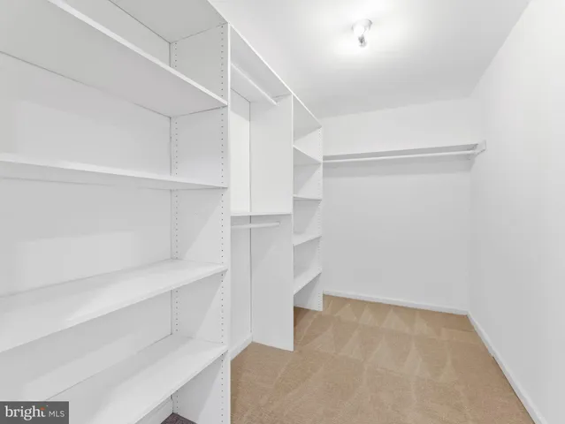 a view of a hallway with closet