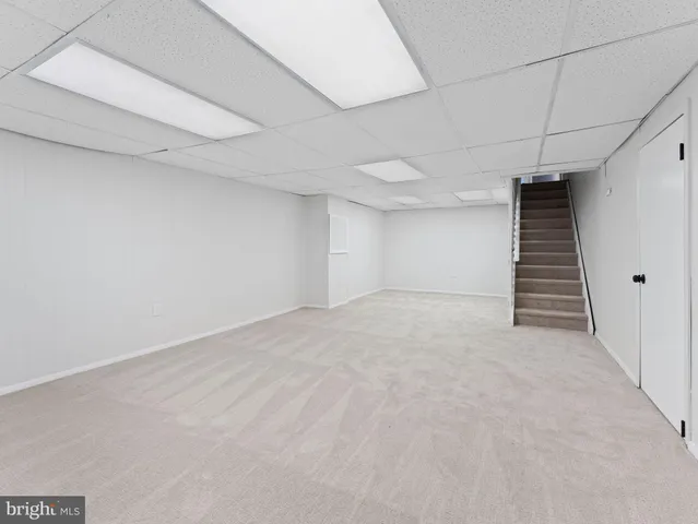 a view of a house with backyard porch and garden