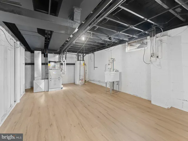 an aerial view of a house with garden space and street view