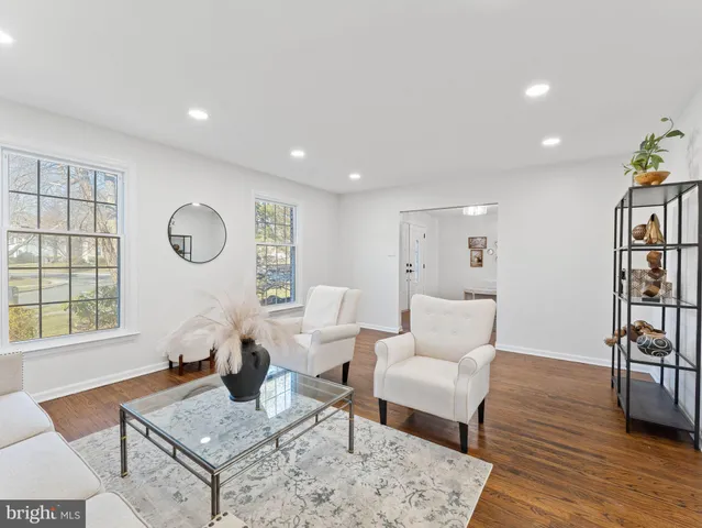 a view of a dining room with furniture wooden floor and chandelier
