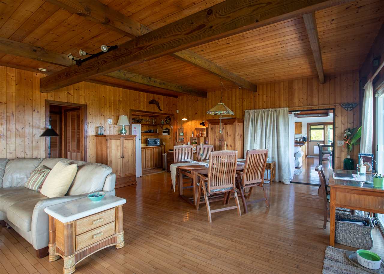 655 Kulike Road, Unit A Haiku, HI 96708 - Photo 11 of 30 a dining room with furniture and wooden floor