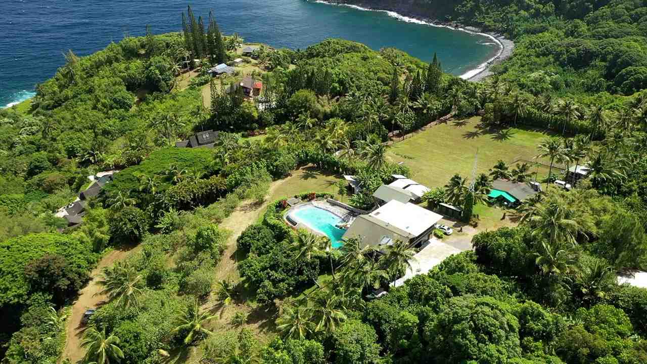655 Kulike Road, Unit A Haiku, HI 96708 - Photo 4 of 30 an aerial view of a house with a yard and lake view