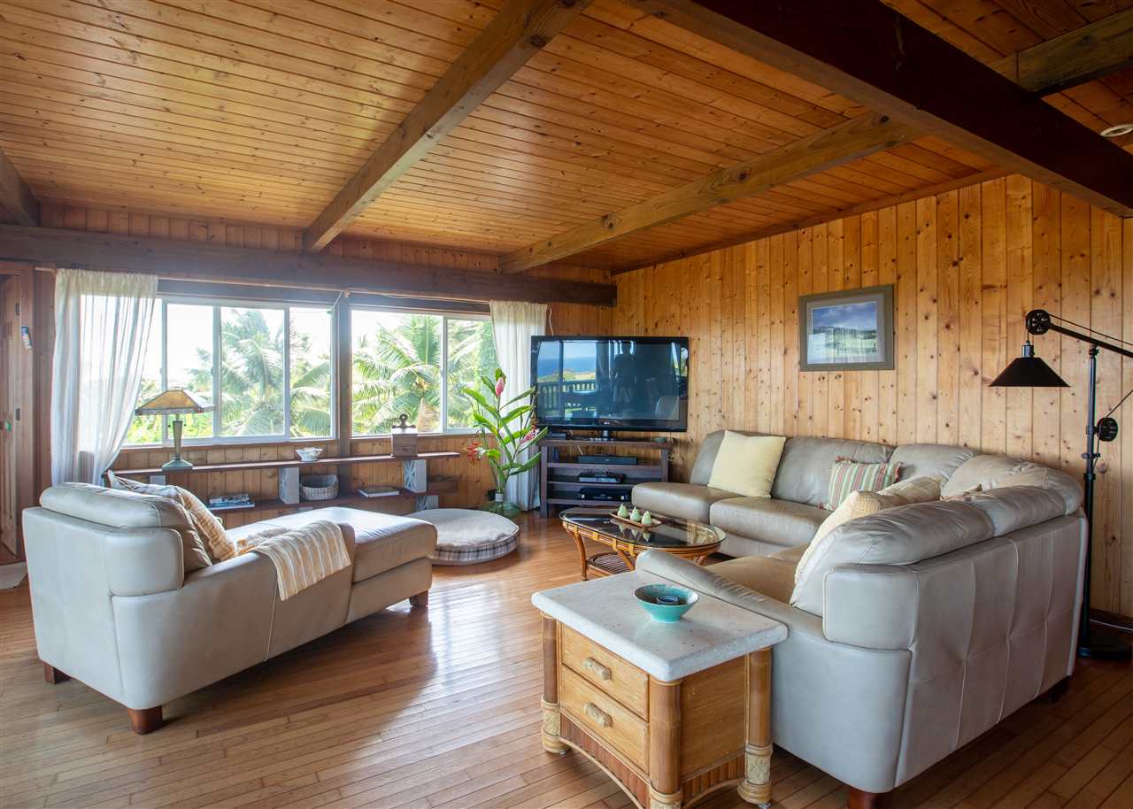655 Kulike Road, Unit A Haiku, HI 96708 - Photo 8 of 30 a living room with furniture and a large window