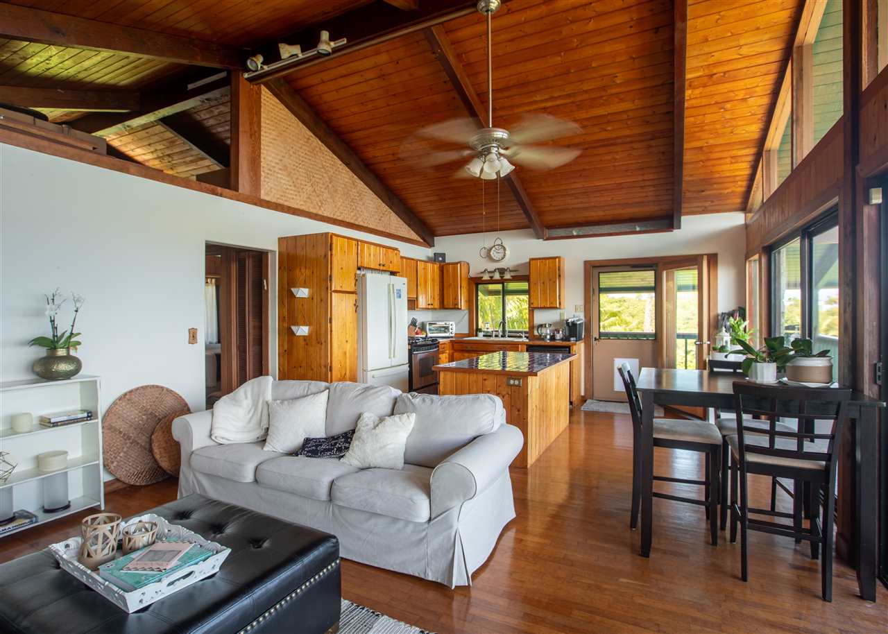 655 Kulike Road, Unit A Haiku, HI 96708 - Photo 9 of 30 a living room with furniture and a large window