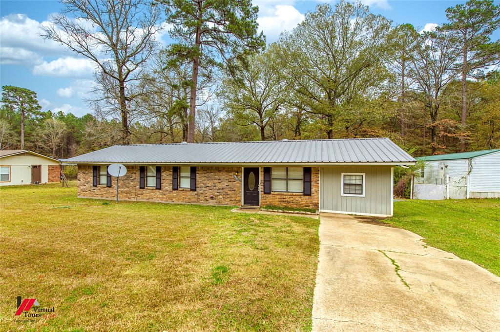 198 7 Pines Road Benton, LA 71006 - Photo 2 of 30 a front view of a house with yard
