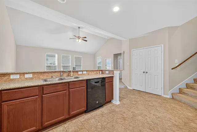 a large bathroom with a granite countertop sink and a mirror