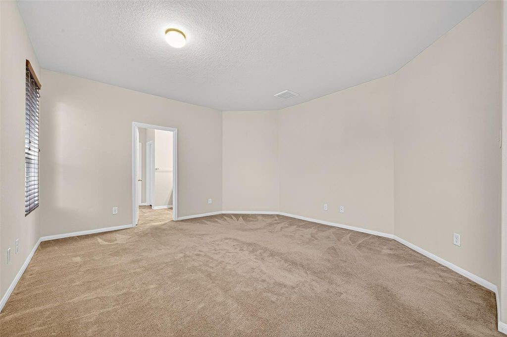 3218 Dappled Vale Trail Spring, TX 77373 - Photo 22 of 47 an empty room with an entryway