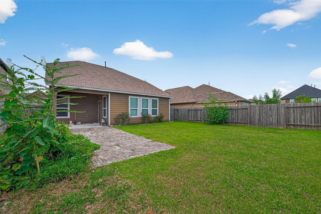 3218 Dappled Vale Trail Spring, TX 77373 - Photo 45 of 47 a view of a house with a yard and a garden
